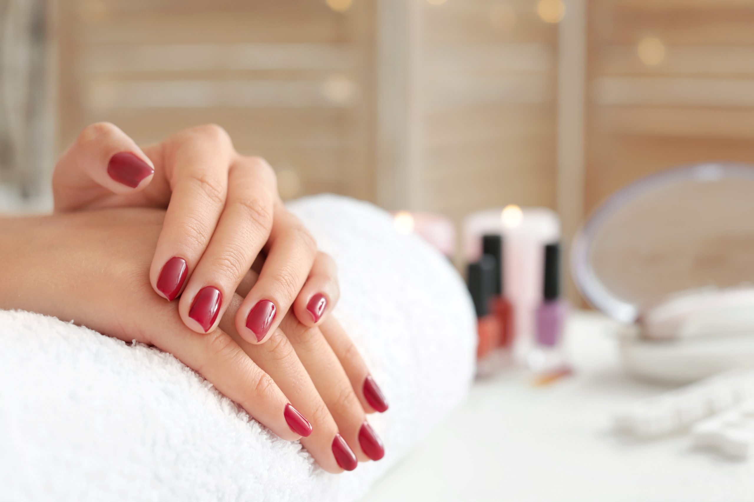 Woman with beautiful manicure in salon