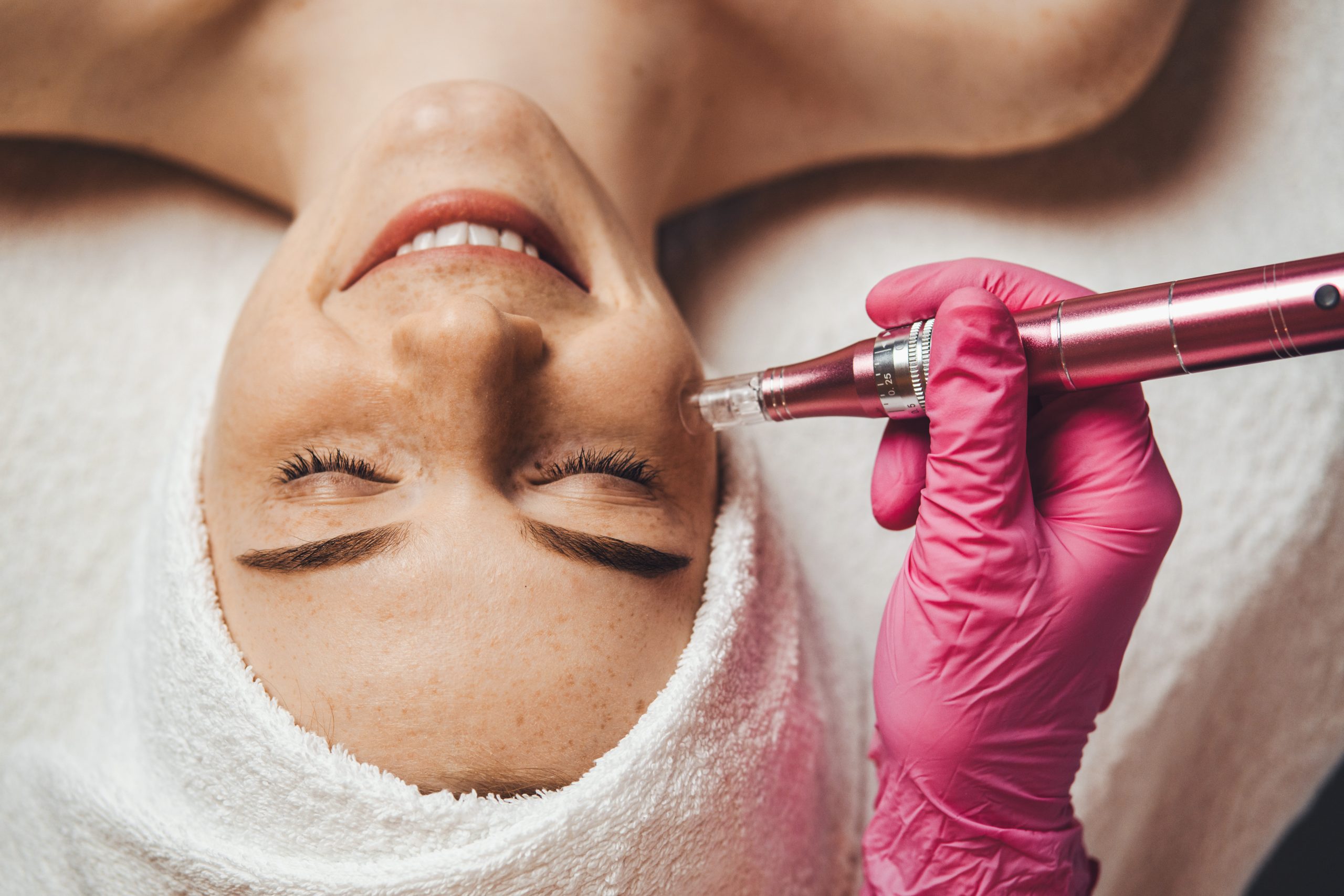 Close-up portrait of woman getting facial hydro microdermabrasion peeling treatment at spa clinic. Facial treatment. Beauty face. Beauty skin. Aesthetic cosmetology, face care
